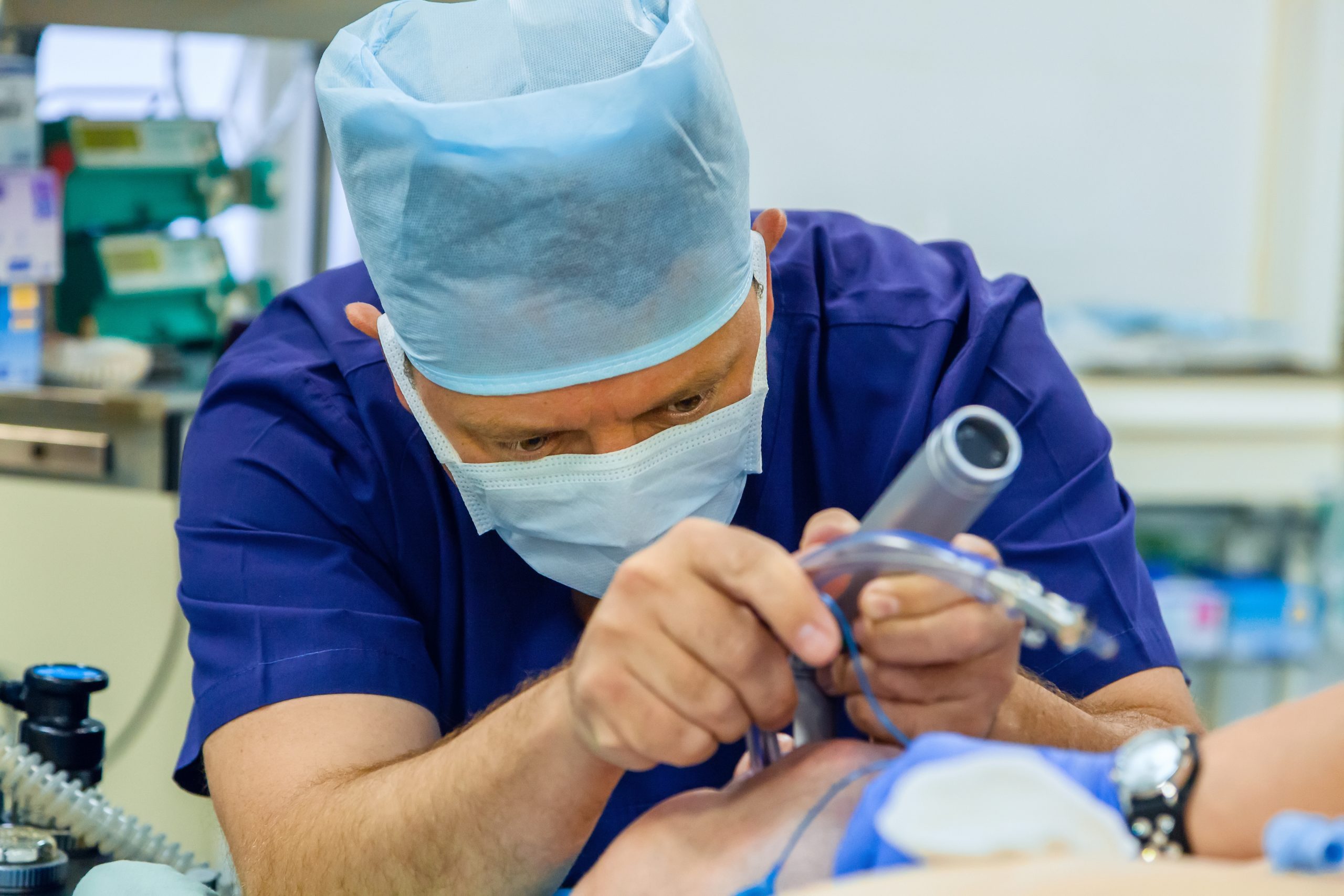 Anesthesiologist performs tracheal intubation for patient in operation room
