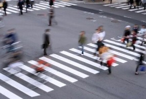 People passing pedestrian lane