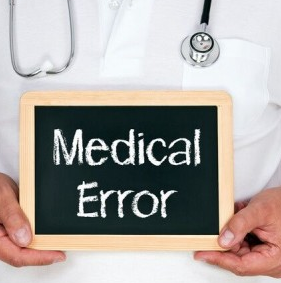 Doctor holding a "Medical Error" sign