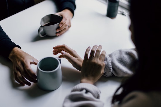 Woman talking to her family about what to do after an assault