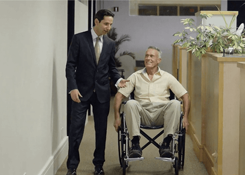 lawyer with a client in wheelchair